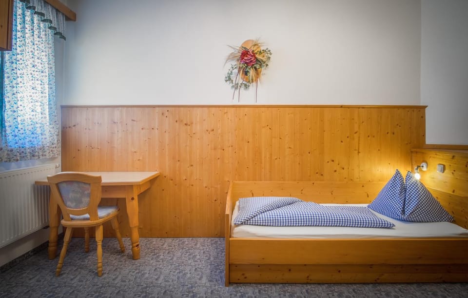 Bed, Living room, Seating area, Bedroom