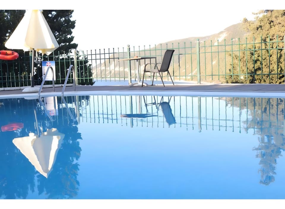 Property building, Living room, Swimming pool