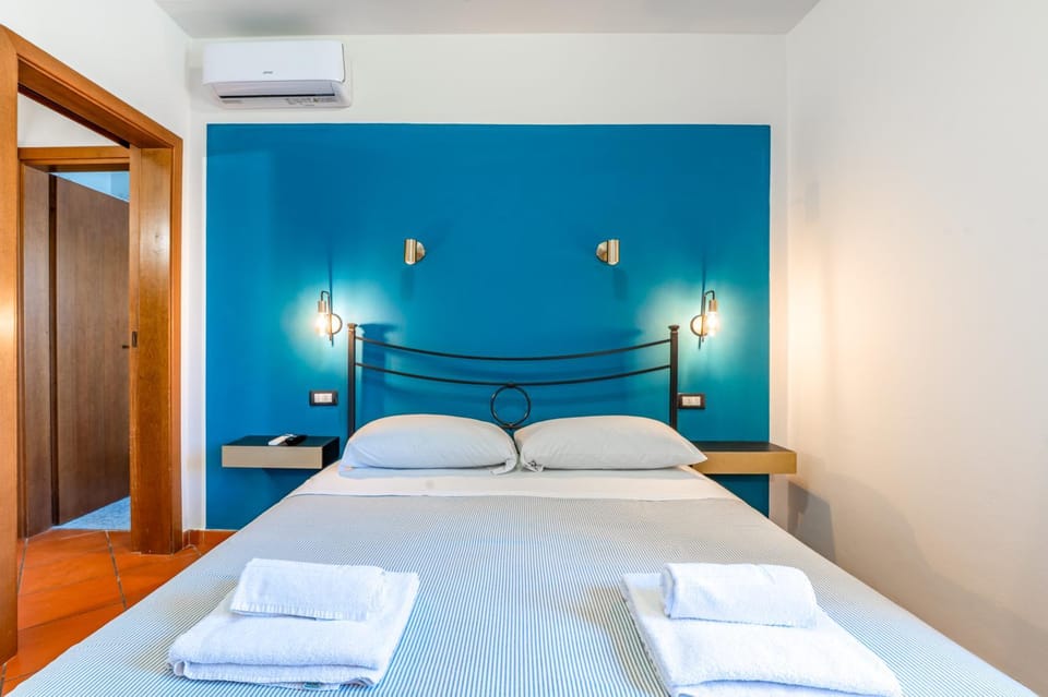 Bed, Photo of the whole room, Bedroom, towels, air conditioner
