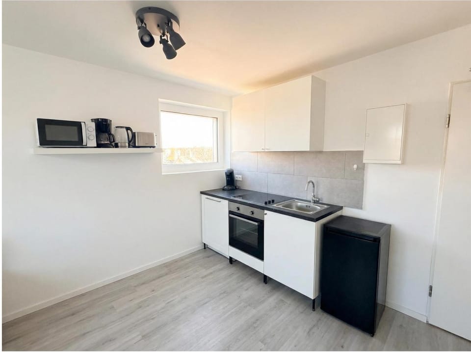 Kitchen or kitchenette, oven, stove, toaster