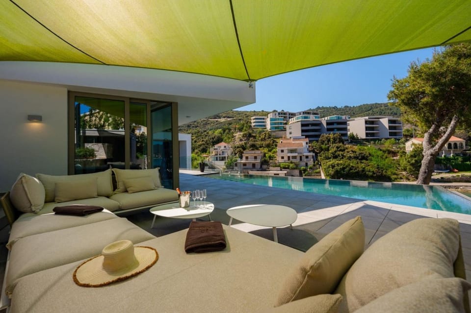 Property building, Seating area, Pool view, Swimming pool, sunbed