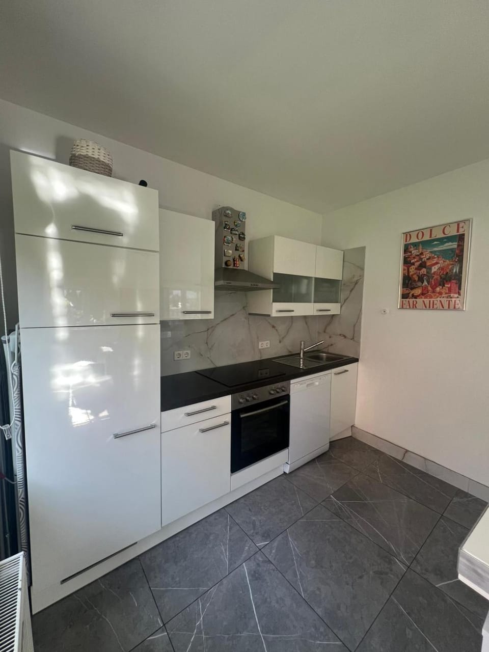 Kitchen or kitchenette, dishwasher, oven, stove