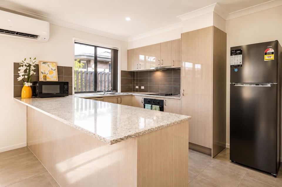 Kitchen or kitchenette, microwave, oven, stove, air conditioner