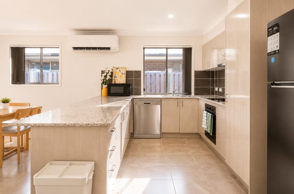 Kitchen or kitchenette, Dining area, dishwasher, microwave, oven, air conditioner