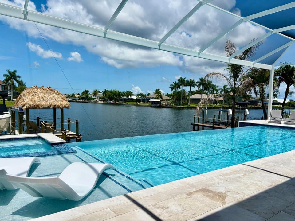 CoralVilla Aesthetic View - on water, pool, spa, boating, BBQ, tiki hut House in Cape Coral