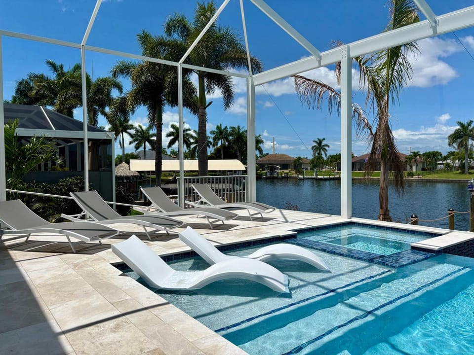 CoralVilla Aesthetic View - on water, pool, spa, boating, BBQ, tiki hut House in Cape Coral