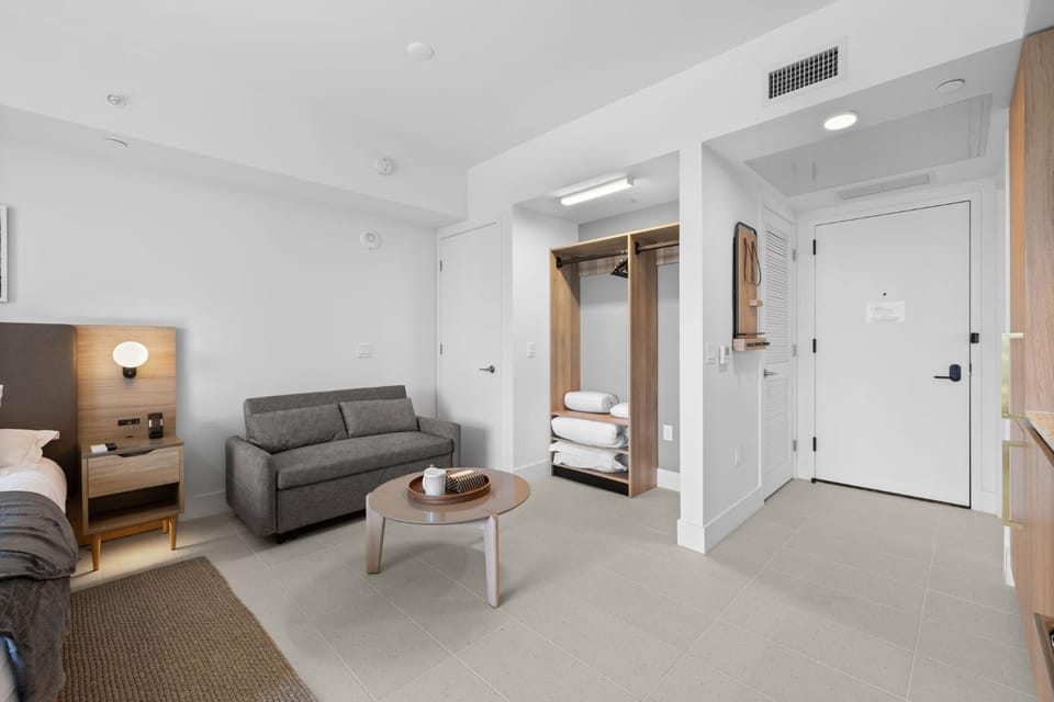 Bed, Seating area, towels, wardrobe