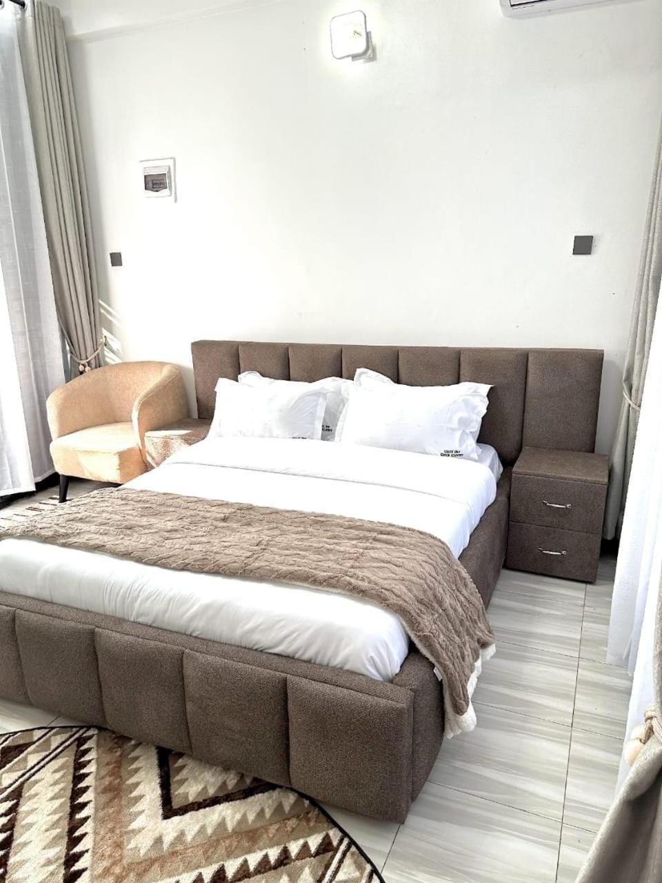 Bed, Living room, Seating area, Bedroom