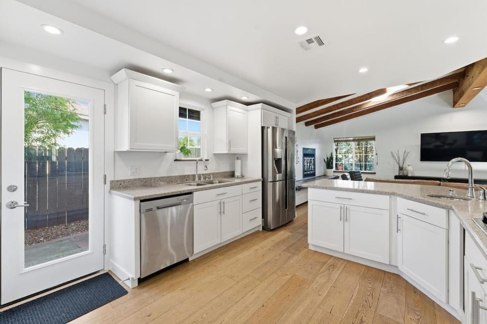 Kitchen or kitchenette, dishwasher, oven, stove