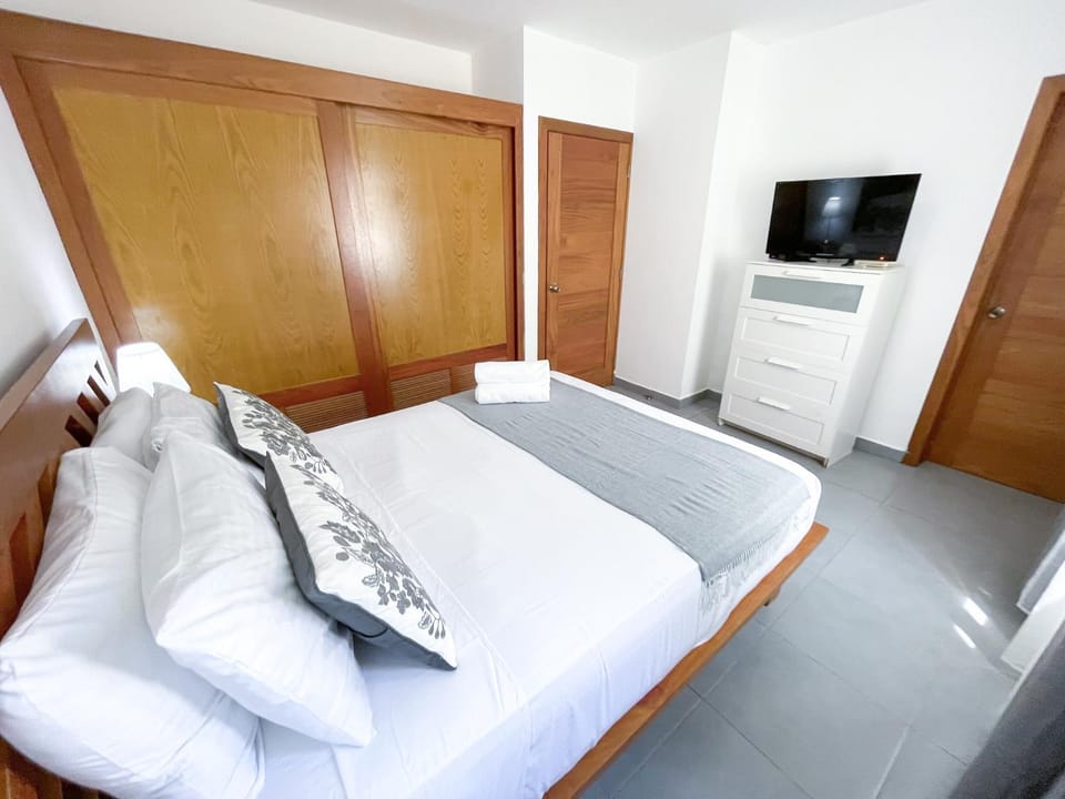 Bed, TV and multimedia, Living room, Seating area, Bedroom, wardrobe