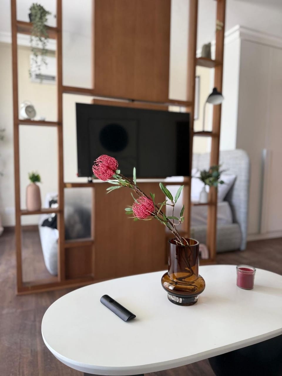 A luxurious bedroom and a cozy living area with a stunning view of the swimming pool Apartment in New Cairo City