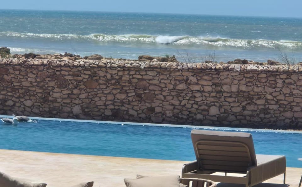 Patio, Day, Natural landscape, Beach, Pool view, Sea view, Swimming pool, sunbed