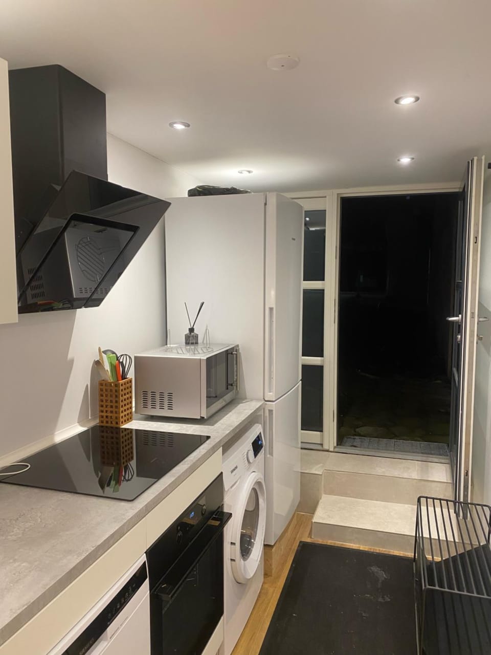 Kitchen or kitchenette, dishwasher, oven, washing machine, dryer