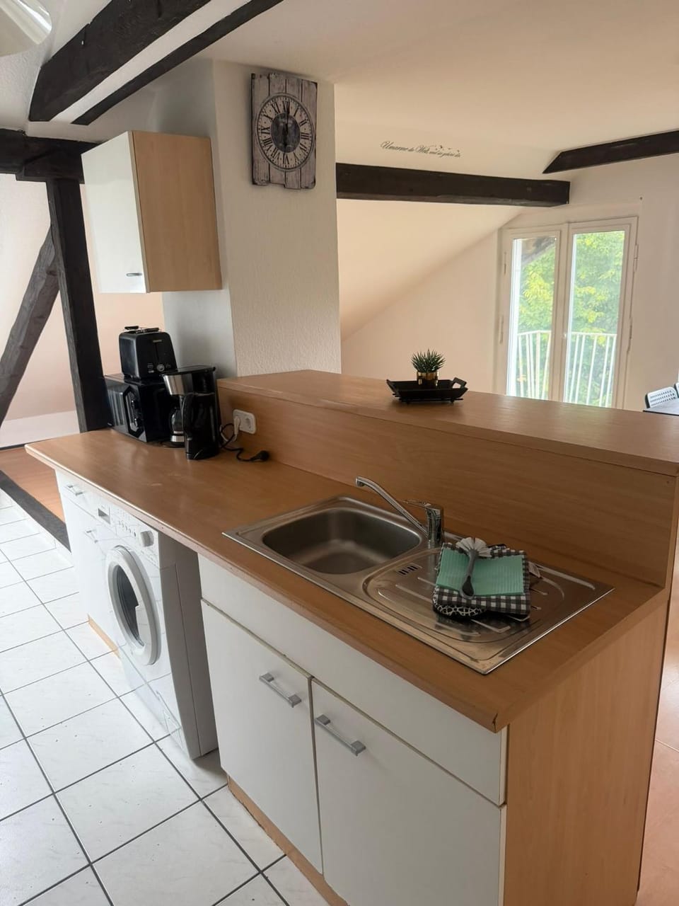 Kitchen or kitchenette, washing machine