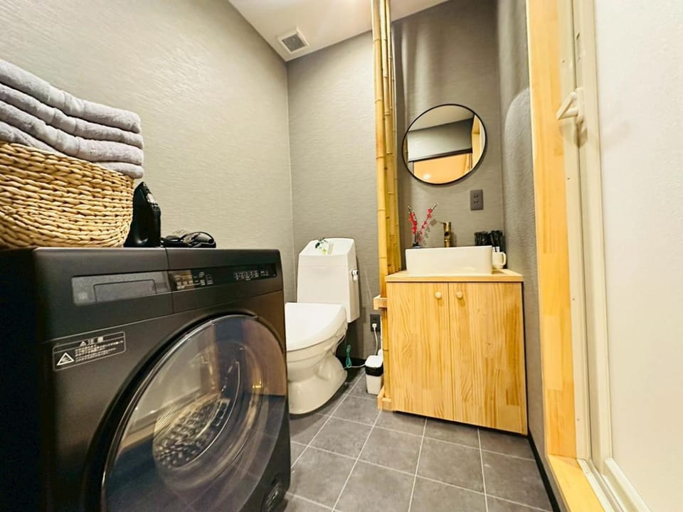 Toilet, towels, washing machine, dryer