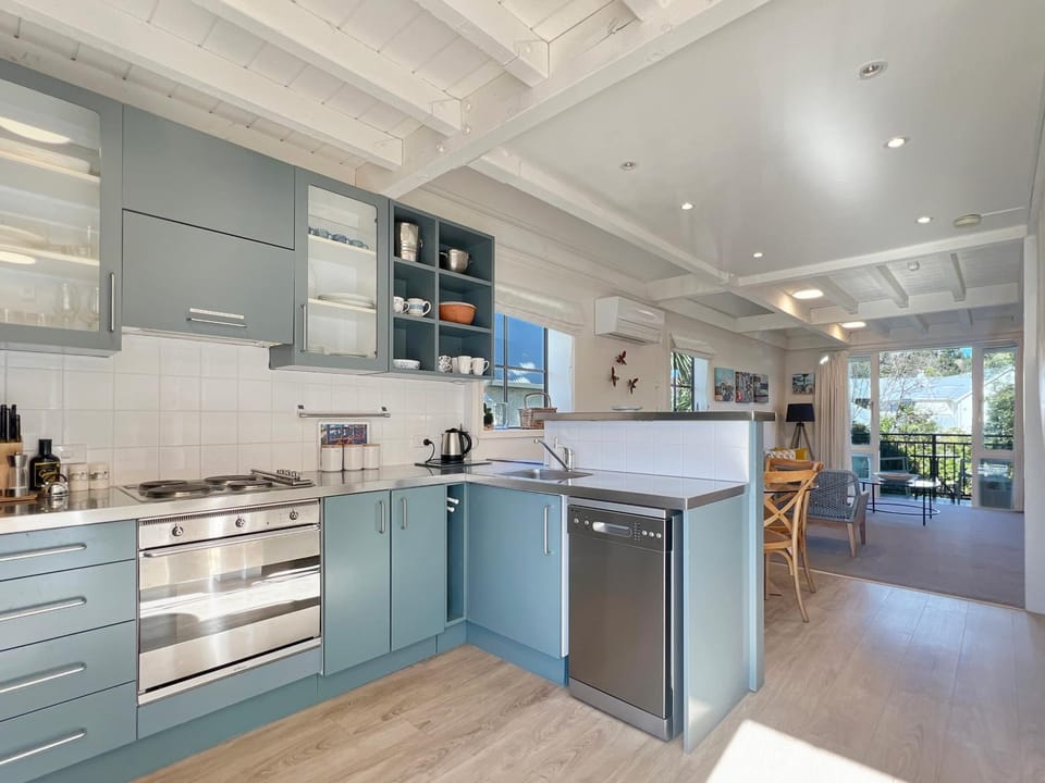 Kitchen or kitchenette, dishwasher, oven, stove