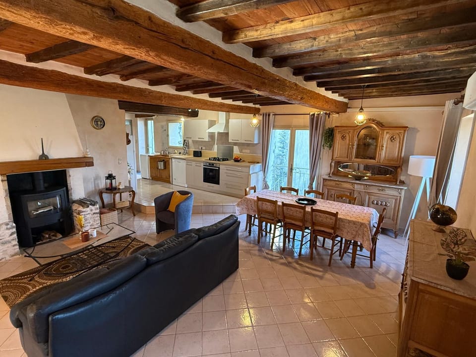 Living room, Dining area, fireplace, kitchen, air conditioner