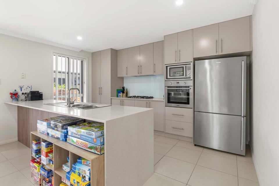 Kitchen or kitchenette, dishwasher, oven, stove