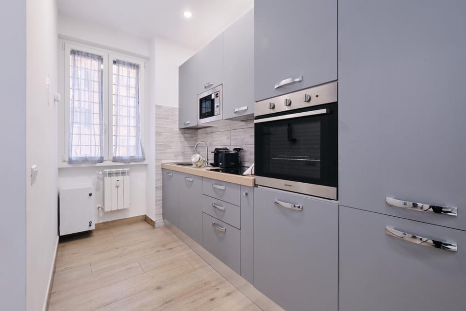 Kitchen or kitchenette, dishwasher, oven, stove, toaster