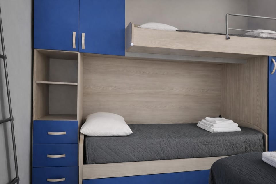 Photo of the whole room, bunk bed, towels, wardrobe