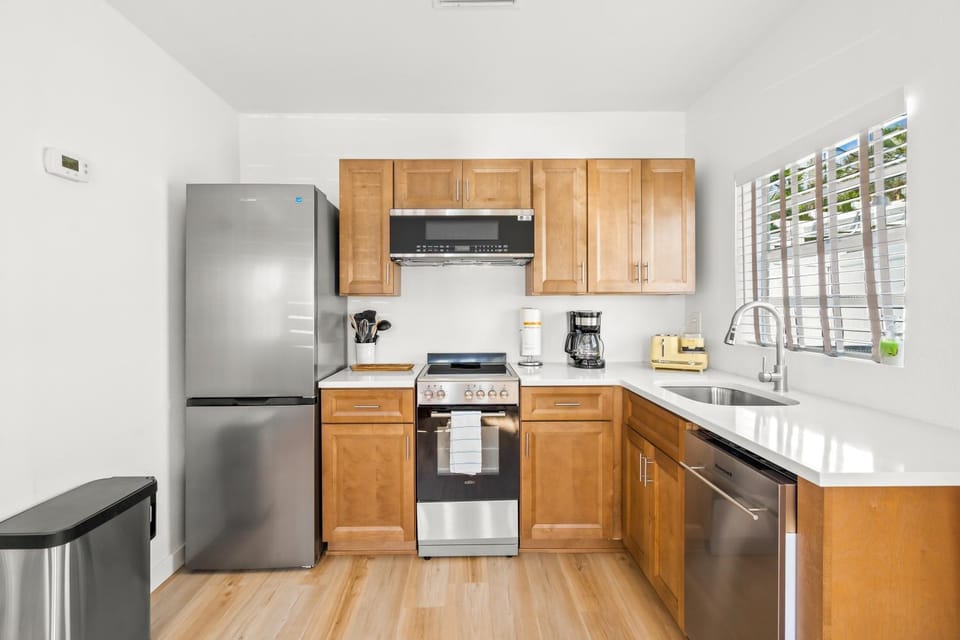 Kitchen or kitchenette, dishwasher, microwave, oven, stove