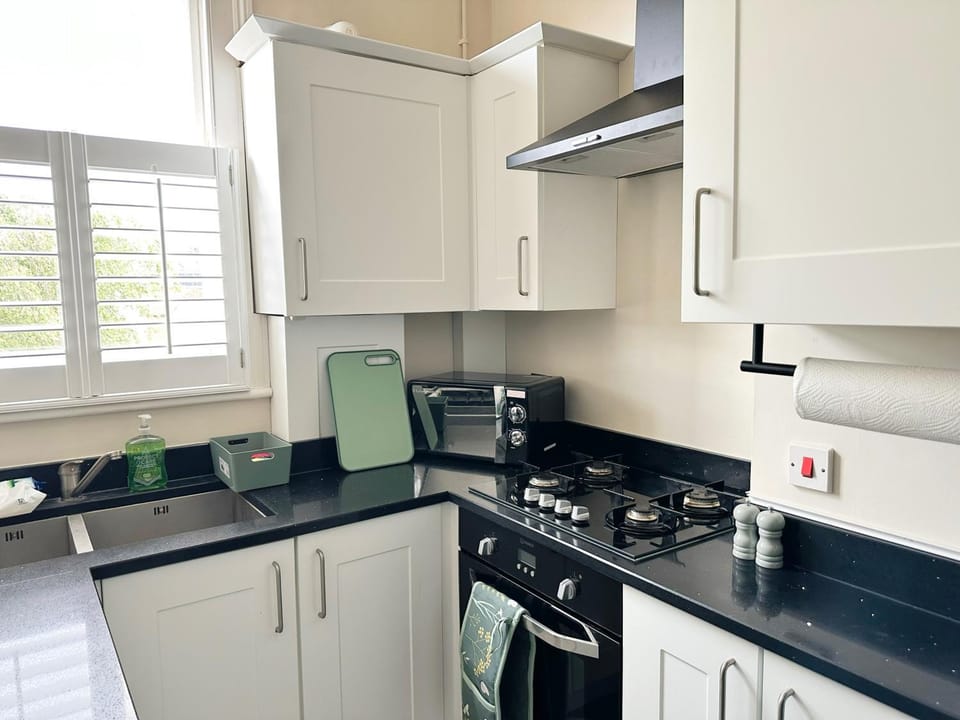 Kitchen or kitchenette, dishwasher, oven, stove, toaster