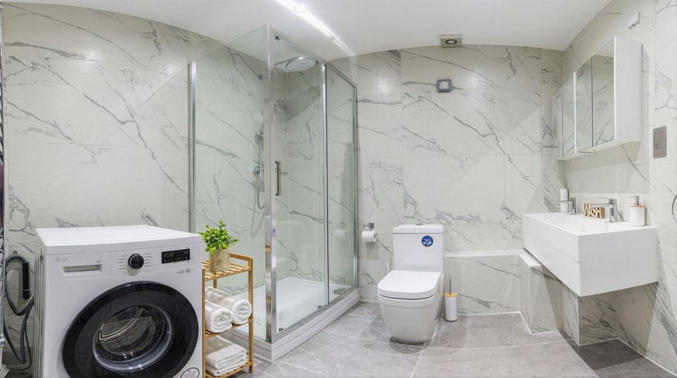 Shower, Toilet, Bathroom, towels, washing machine, dryer