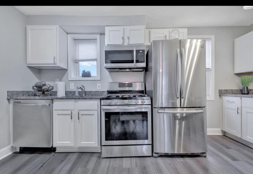 Kitchen or kitchenette, dishwasher, oven, stove