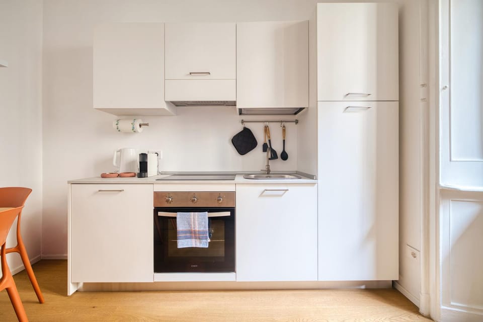 Kitchen or kitchenette, dishwasher, oven, stove