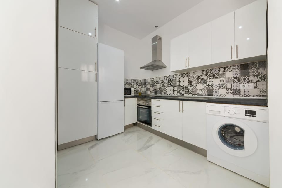 Kitchen or kitchenette, dishwasher, minibar, oven, stove, washing machine, dryer