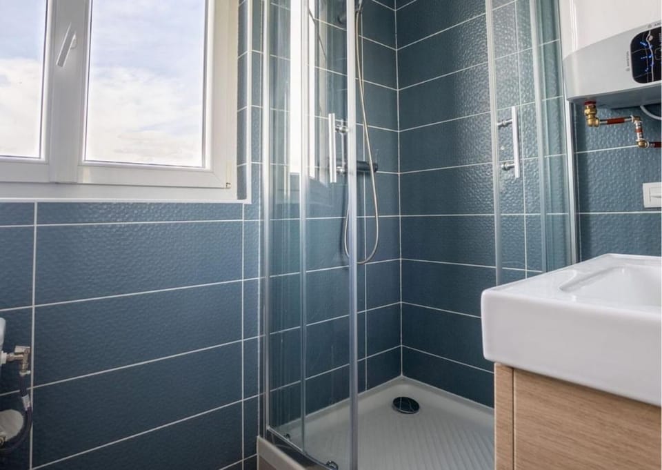 Shower, Toilet, flat iron, hair dryier, towels