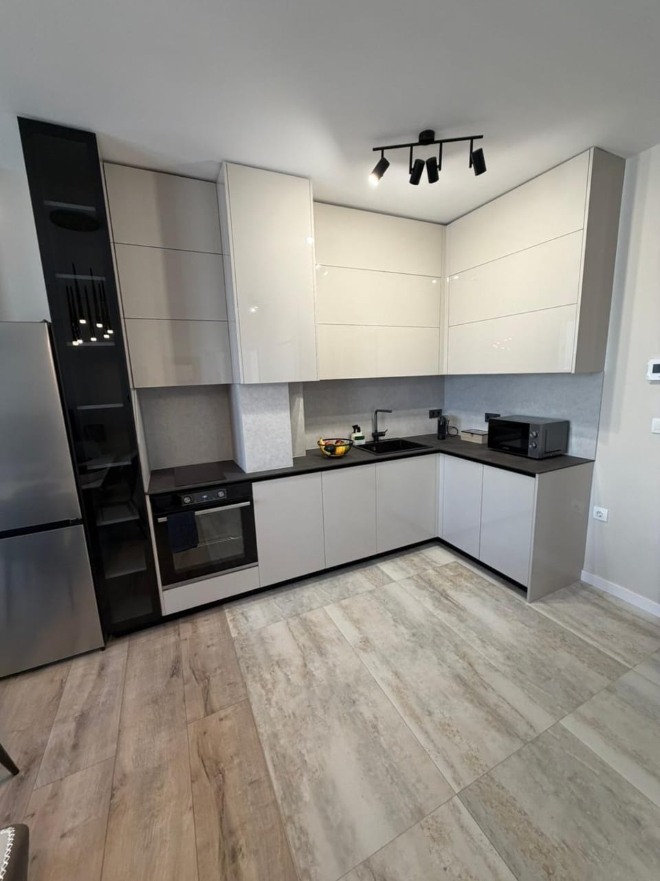 Kitchen or kitchenette, dishwasher, oven, stove