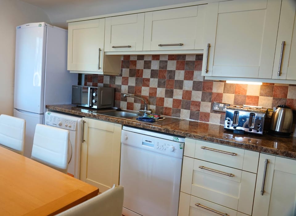 Kitchen or kitchenette, dishwasher, oven, pet friendly, stove, toaster