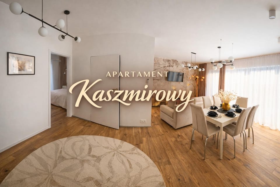 Property logo or sign, TV and multimedia, Kitchen or kitchenette, Living room, Seating area, Dining area, Logo/Certificate/Sign, Text overlay, Garden view, Certificate/Award, air conditioner