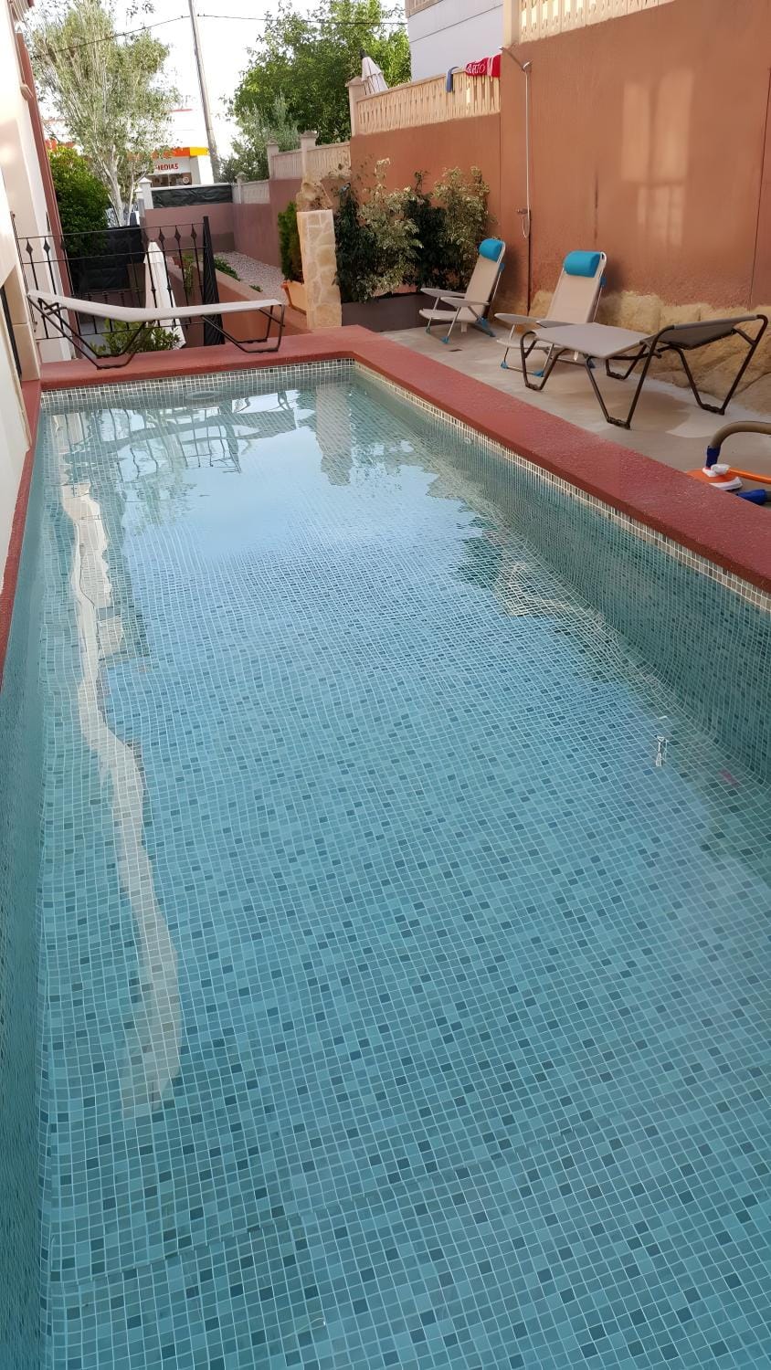 Property building, Living room, Swimming pool
