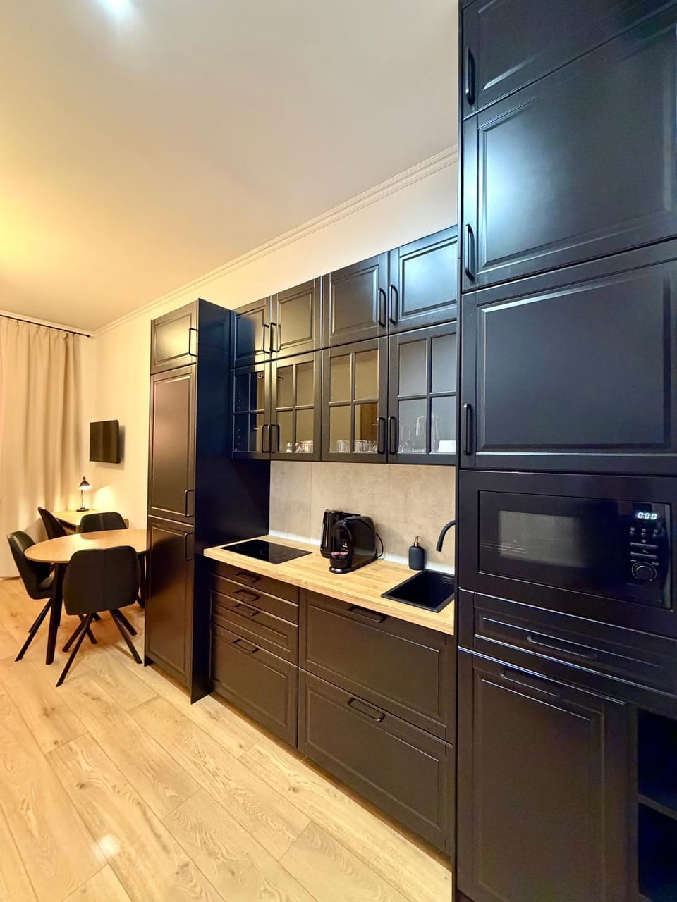 Kitchen or kitchenette, microwave, stove, toaster