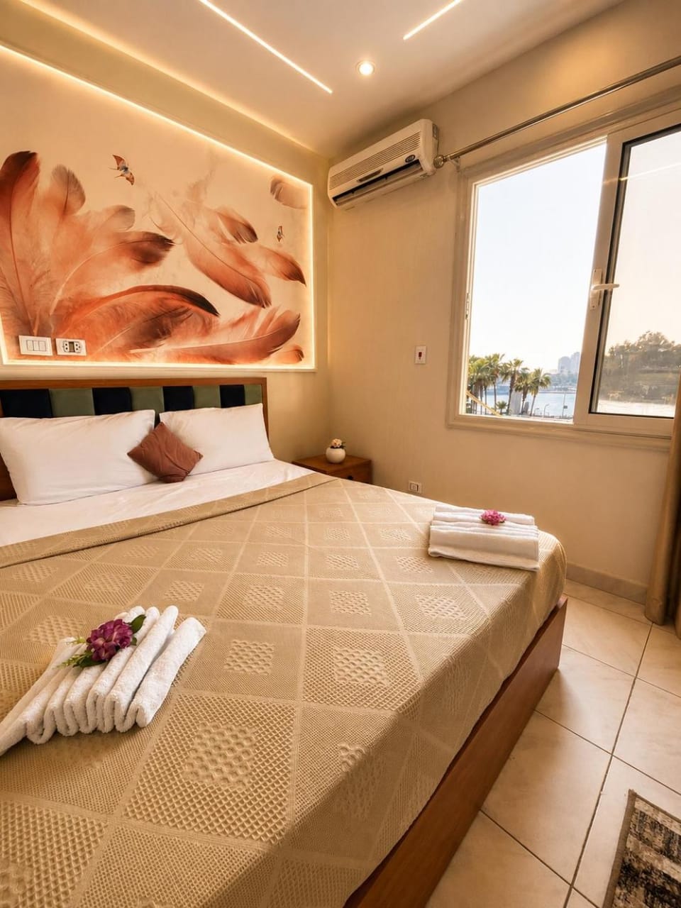 Bed, Photo of the whole room, Bedroom, towels, air conditioner
