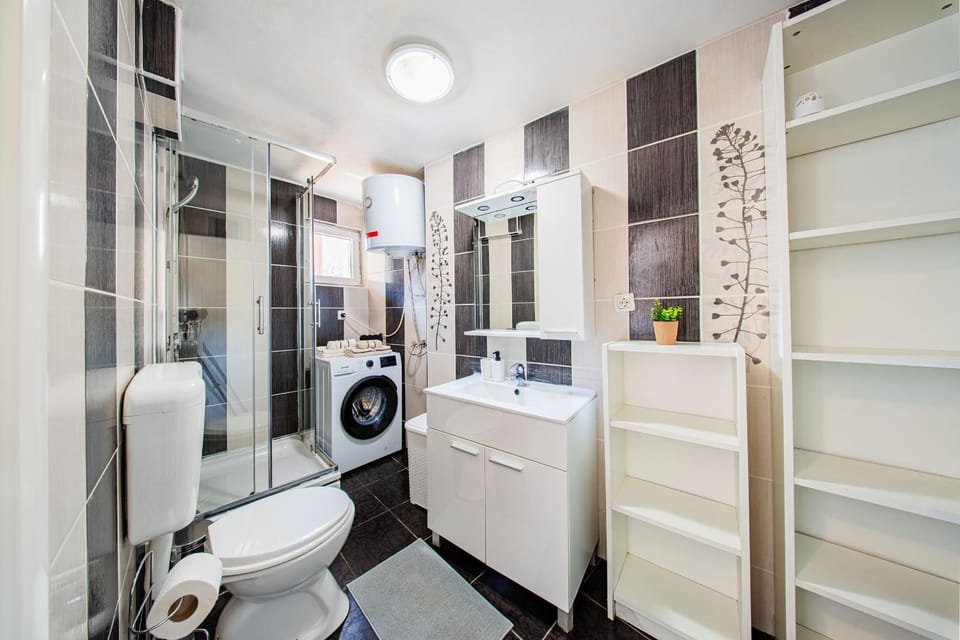Shower, Toilet, Bathroom, towels, washing machine, dryer