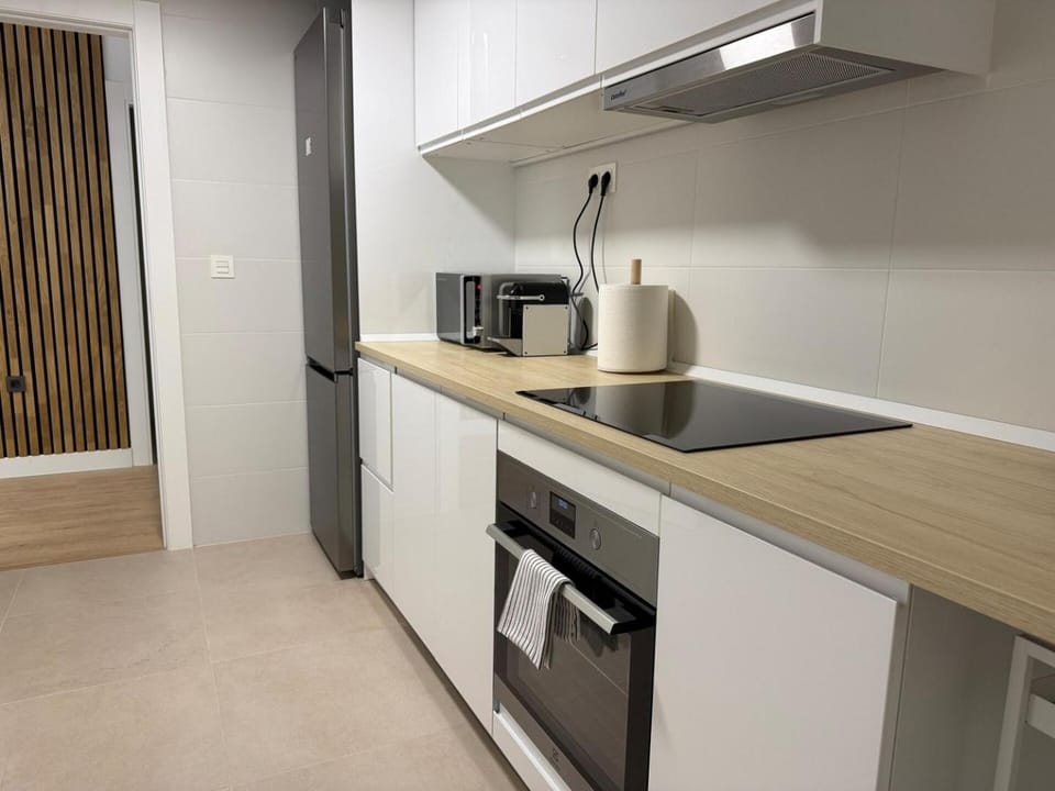 Kitchen or kitchenette, oven, stove, toaster
