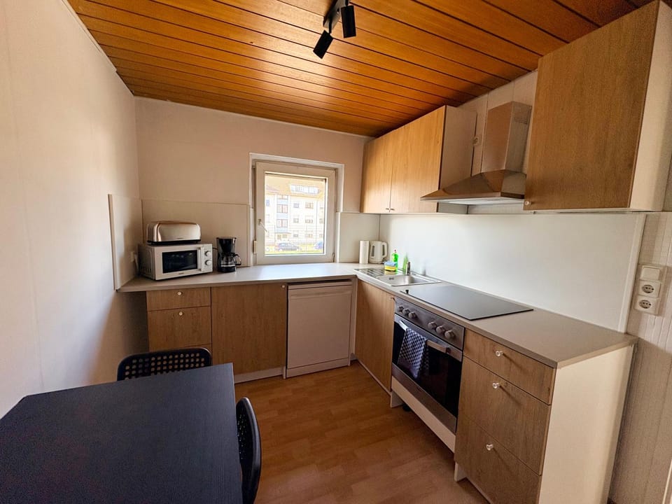 Kitchen or kitchenette, dishwasher, oven, stove, toaster