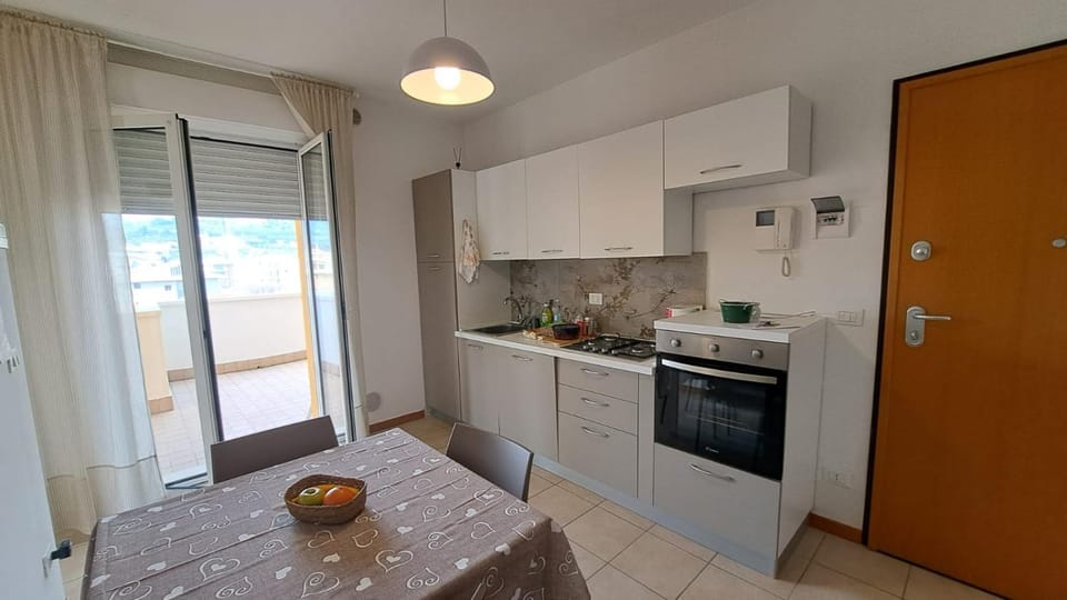 Kitchen or kitchenette, dishwasher, oven, stove