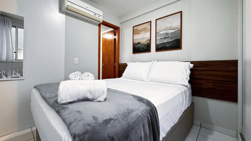 Bed, Decorative detail, towels, air conditioner