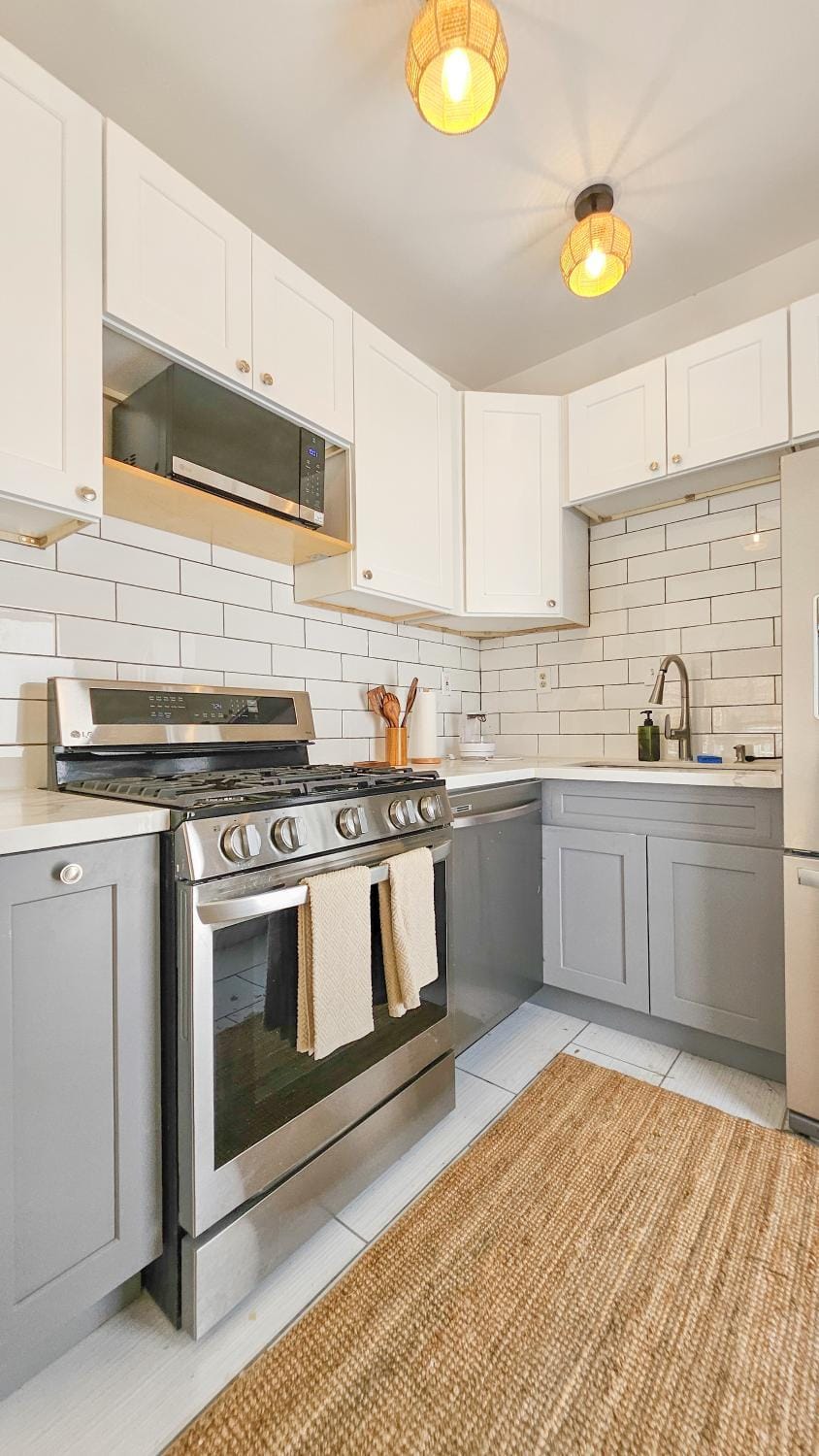 Kitchen or kitchenette, dishwasher, microwave, oven, stove