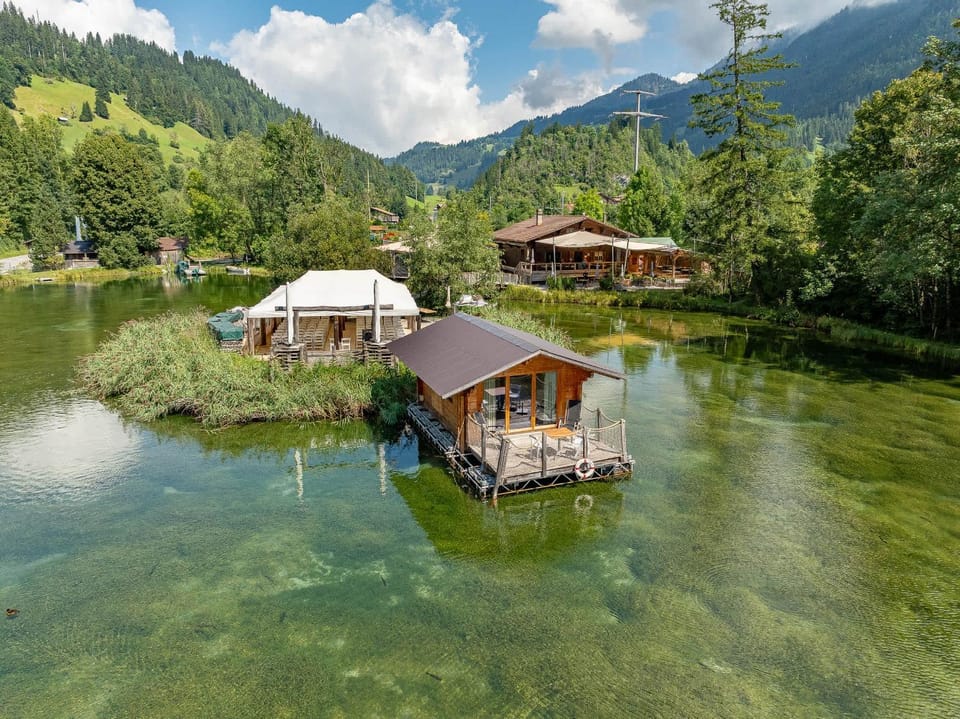 Tiny Water Villa on a Lake with shared camping bathroom House in Saanen