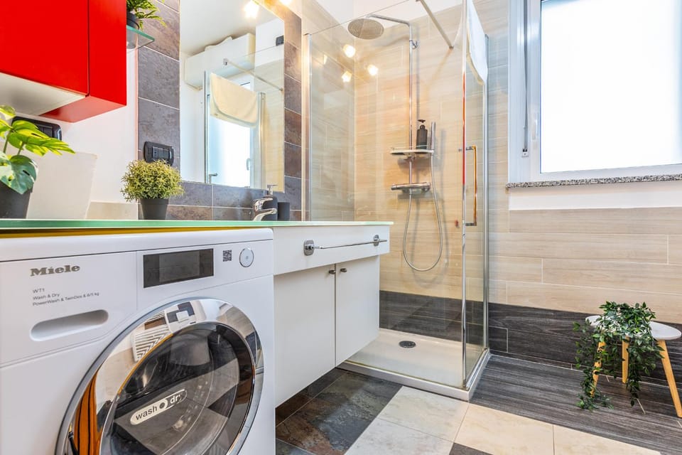 Shower, Bathroom, hair dryier, towels, washing machine, dryer