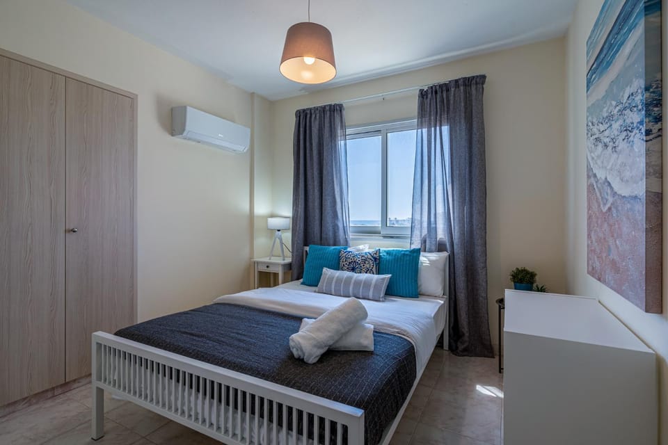 View (from property/room), Bedroom, flat iron, hair dryier, towels, wardrobe, air conditioner