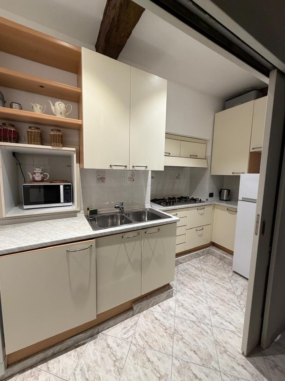 Kitchen or kitchenette, dishwasher, oven, stove
