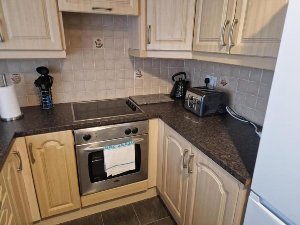 Kitchen or kitchenette, furniture, oven, stove, toaster