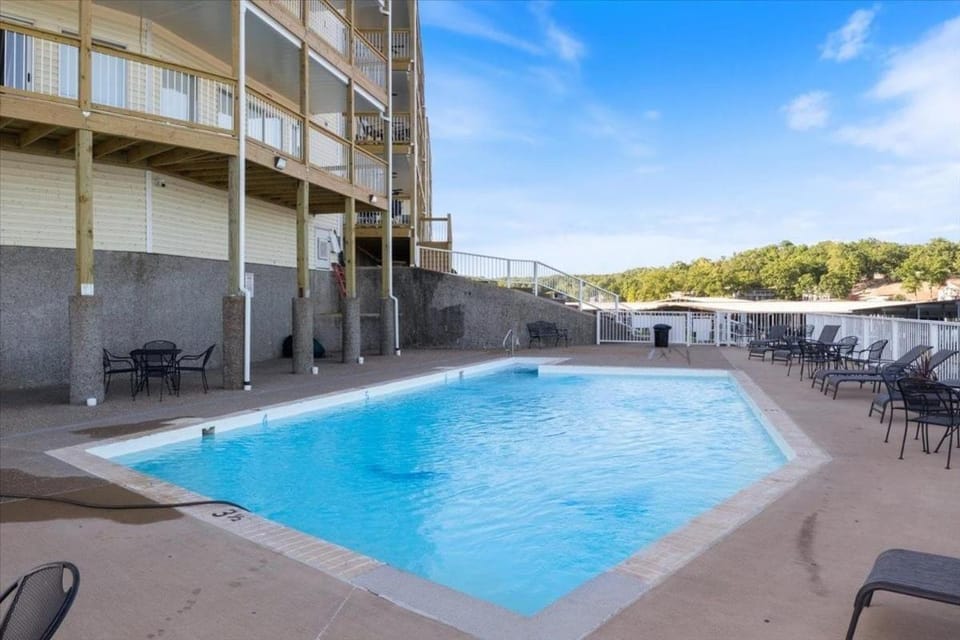 Property building, Patio, Day, View (from property/room), Balcony/Terrace, Swimming pool, Swimming pool, sunbed