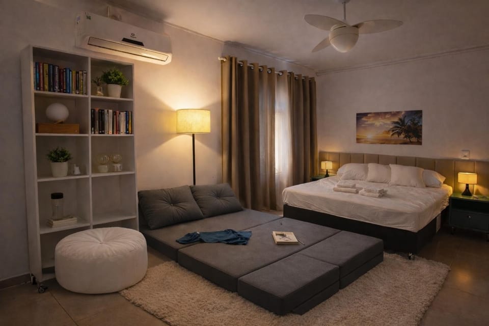 Bed, Library, Living room, Photo of the whole room, Seating area, Bedroom, fireplace, towels, air conditioner
